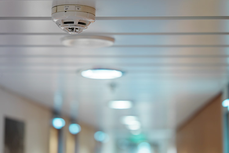 A Consilium fire detector in the roof of a cruise ship